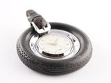 a watch that is sitting on top of a tire