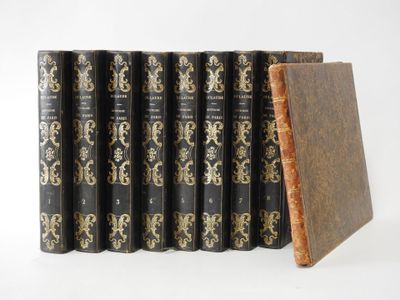 six books are lined up in a row on a white surface
