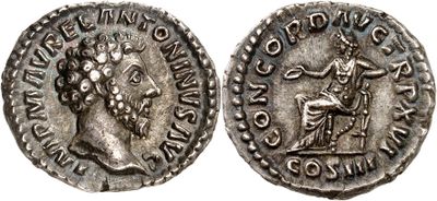 a silver coin with an image of a man holding a sword