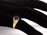 an image of a close up of a person ' s hand with a ring on it