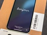 an iphone is sitting on top of a box with a barcode on it