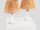 two lamps on a white pedestal with a white base and a brown shade