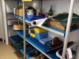 a shelf with many items on it in a room