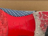 a close up of a pair of red shoes on a table