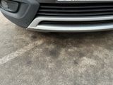 a close up of the front of a car with a license plate