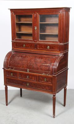 an old wooden bureau with two drawers and a glass door