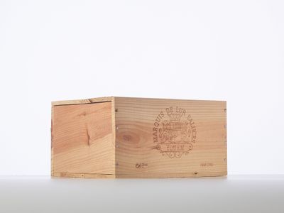 an empty wooden box sitting on top of a white surface