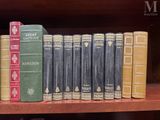 many books that are on a shelf in a book case