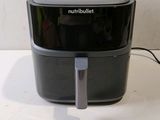 an image of a black and silver blender sitting on a counter