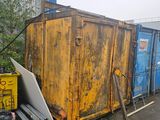 a yellow dumpster sitting next to a blue dumpster