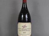 a bottle of wine that is sitting on a table