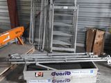 a large pile of metal items in a garage