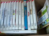 a lot of wii games in a cardboard box