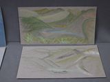 three paintings on the table one is of a mountain and the other is a river
