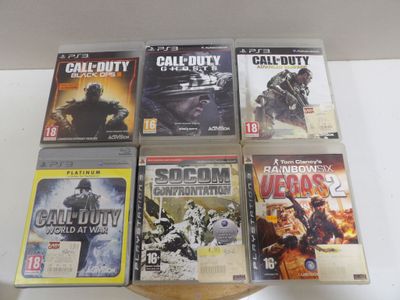 a lot of video games on display on a table