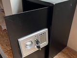 a small safe box in the corner of a room