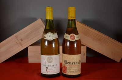 two bottles of wine sitting next to each other on a table