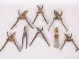 several different types of pliers are arranged on a white surface