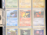 a lot of cards that are in a binder