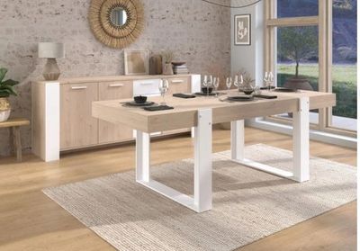 a dining room with a table and chairs in it