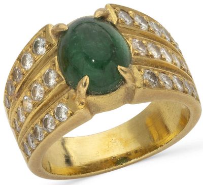 a close up of a ring with a green stone surrounded by diamonds