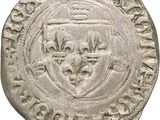 an old silver coin with a shield on it
