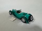 a toy car that is sitting on a white surface