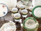 a table with a lot of different plates and cups on it
