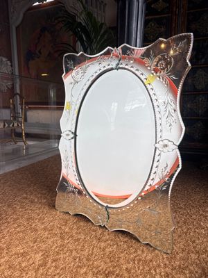 a picture of a mirror that is sitting on the floor