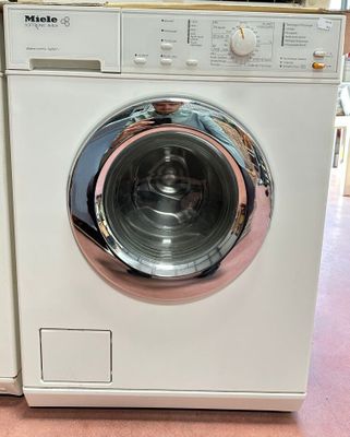a washing machine that is sitting on the floor