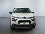 the front of a white citrole parked in a white room