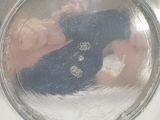 reflection of a person in a mirror with a teddy bear