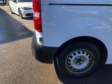 a white van that is parked on the side of the road