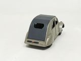 a toy car that is sitting on a white surface