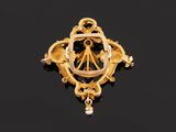 a gold and diamond broochle
