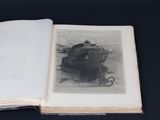 an open book with a drawing of a cat on it