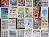 a lot of comic books on the table together
