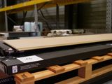 a box of wood on a pallet in a warehouse