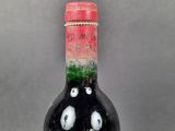 a bottle of wine that has been left on the table