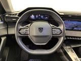 the interior of a car with a steering wheel, dashboard, and display screen