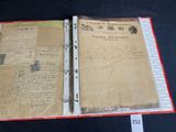 an old book with writing on it sitting on a table