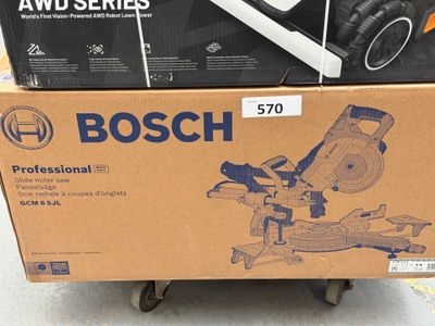 two boxes of headphones on a cart in the store