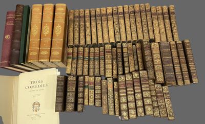 several books are stacked on top of each other on a table