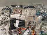 a pile of clothing that is sitting on a table