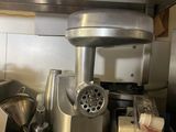a kitchen counter with a blender and other kitchen utensils