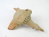 a small clay object that looks like a turtle