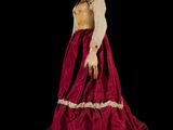 an image of a woman in a red and gold dress