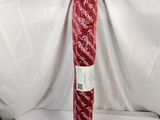 a roll of red wrapping paper on a white surface