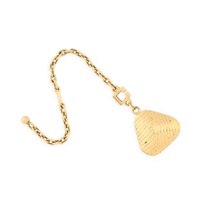 a close up of a gold necklace with a heart on it