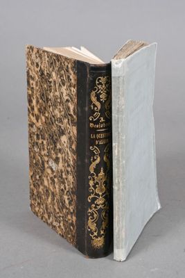 an old book that has been opened to reveal a book